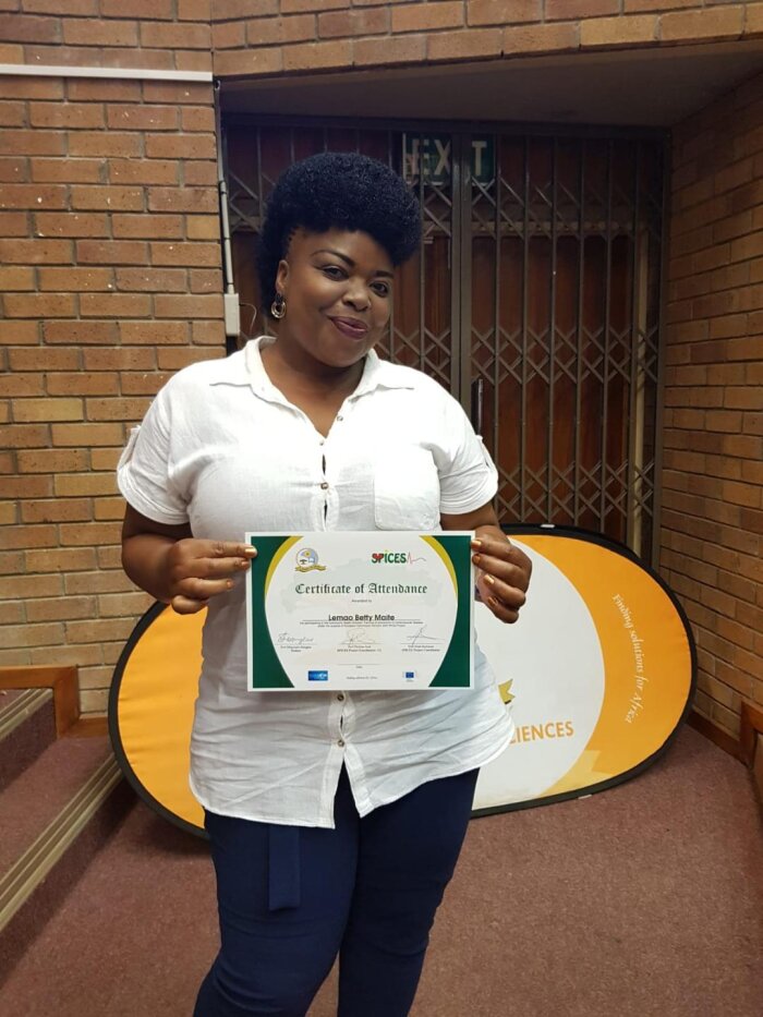 community health worker (lemgo betty) posing with her certificate of attendance after the award ceremony at the university of limpopo in march 2019