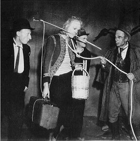 A scene from the first production of En attendant Godot at Paris' Théâtre de Babylone in 1953, with Pierre Latour (Estragon), Jean Martin (Lucky), Lucien Rambourg (Vladimir), and Roger Blin (Pozzo).