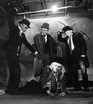 Pierre Latour (Estragon), Roger Blin (Pozzo), Lucien Raimbourg, (Vladimir), and Jean Martin (Lucky) in the first production of En attendant Godot at the Théâtre de Babylone in 1953.